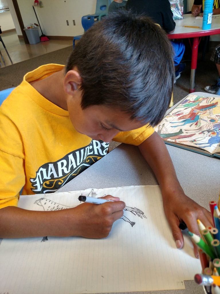 Boy Drawing photo credit Lisa Brunick